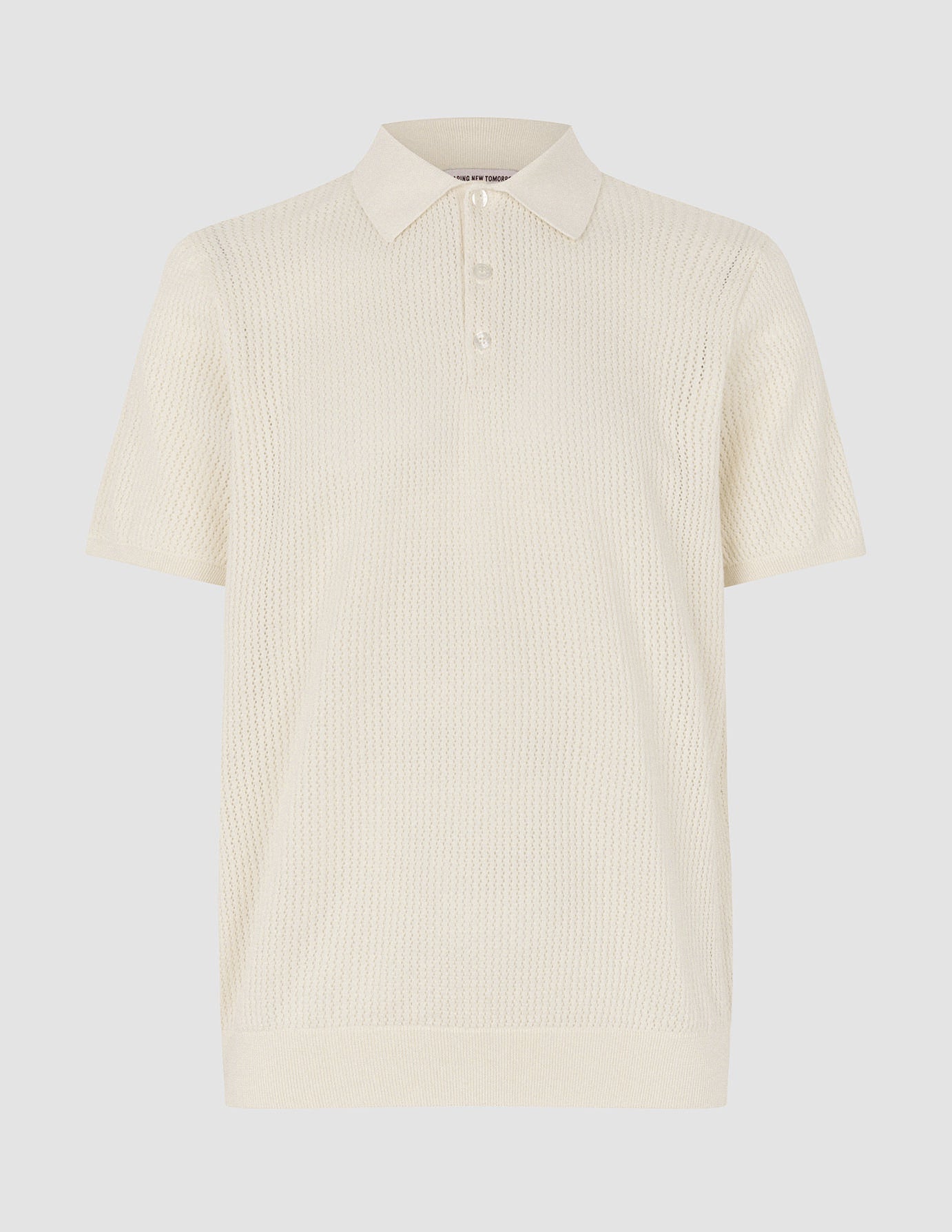 Polo de manga corta de punto texturizado, color crema